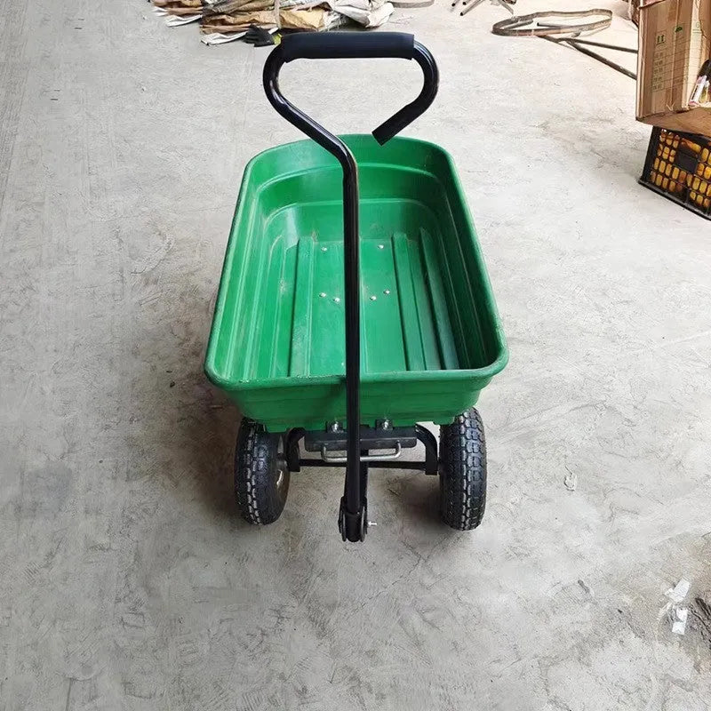 Green four-wheel plastic dump truck with a large load bed, model TC2145.