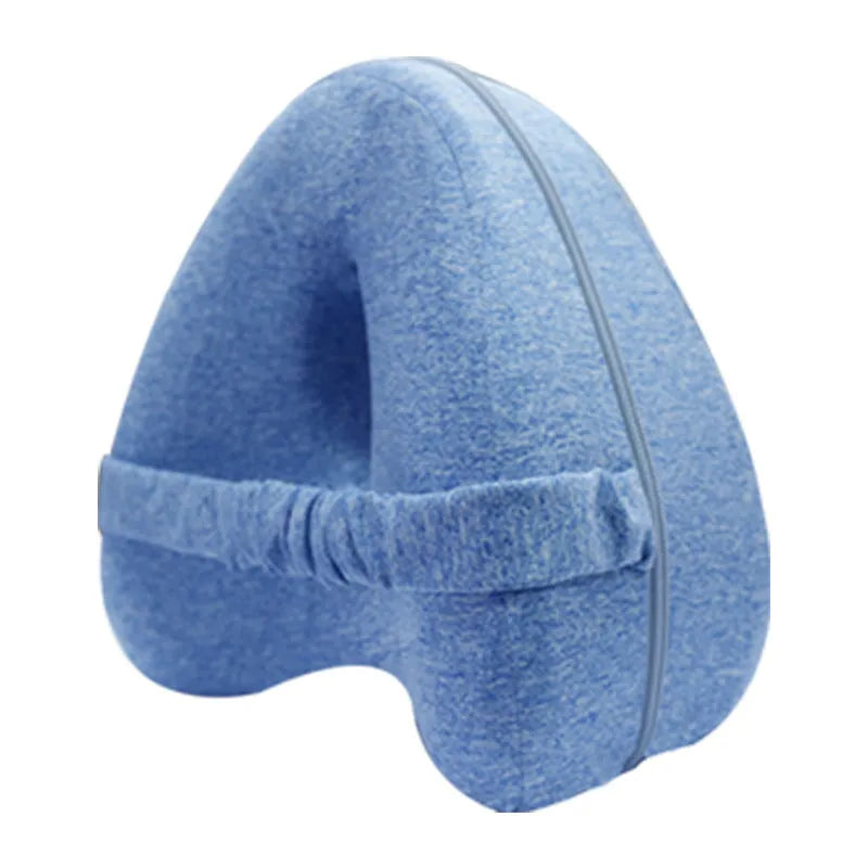 Dark blue jacquard love heart-shaped memory foam leg pillow on a grey sofa