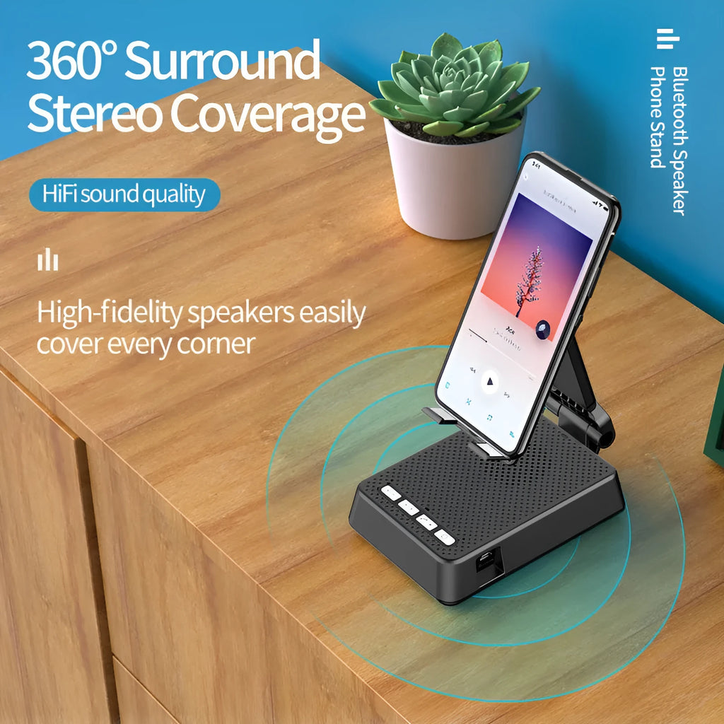 Black mobile phone broadcast stand with integrated Bluetooth speaker and microphone on a desk.