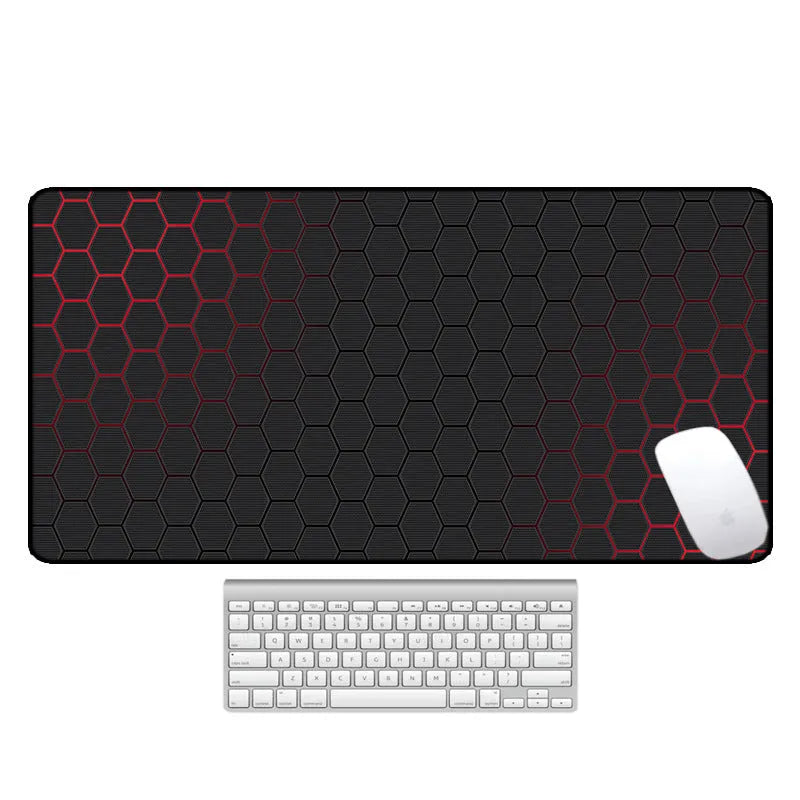 Large printed desk pad mouse mat with natural rubber non-slip base on a wooden desk.