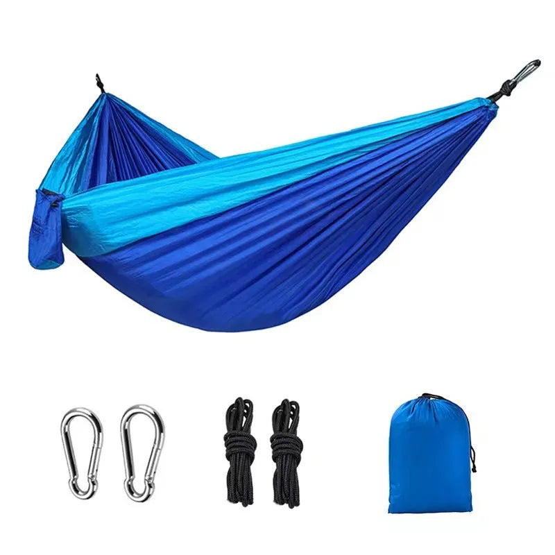 Blue nylon parachute cloth hammock 270x140cm suspended outdoors for camping