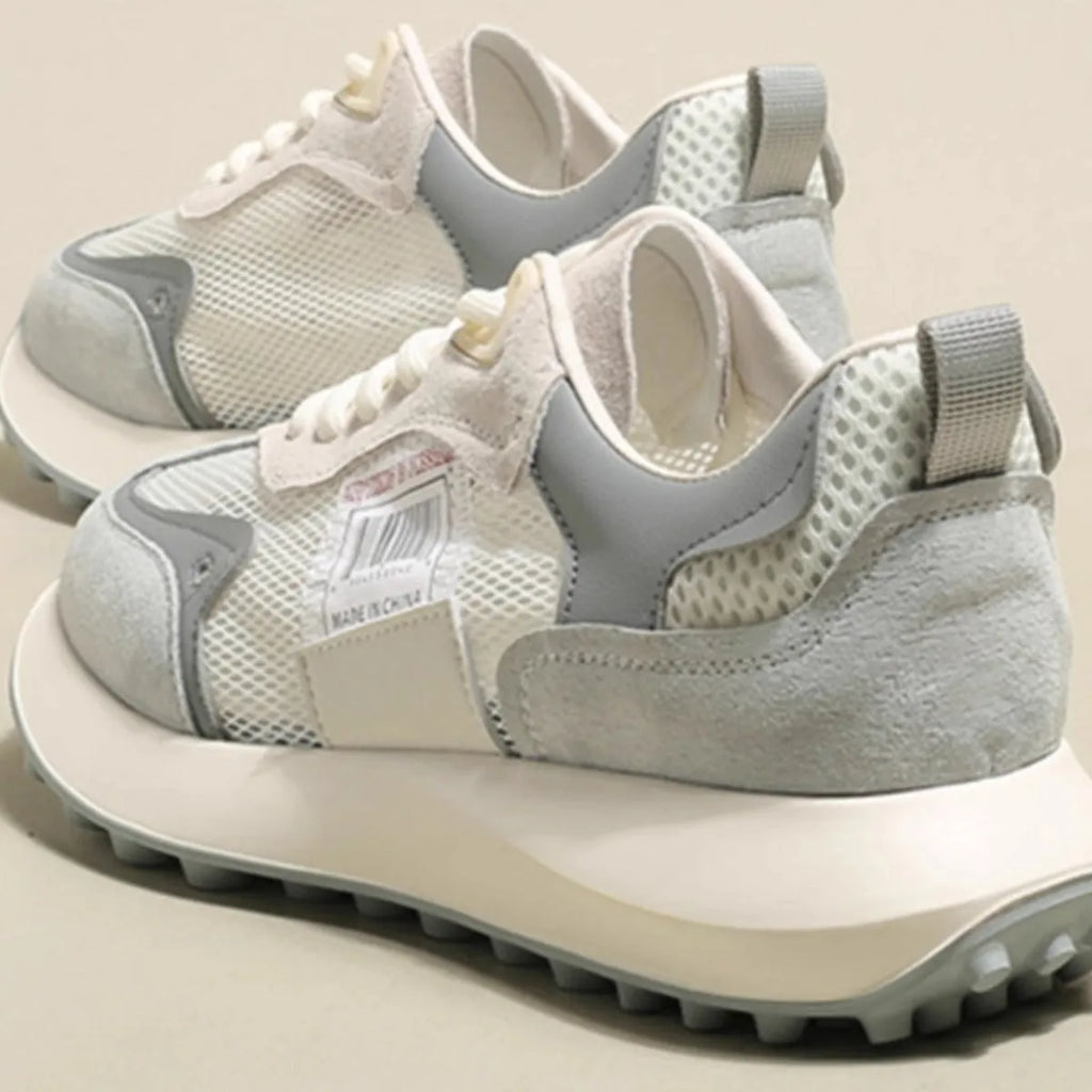 Women's grey and pink low-top retro sneakers with round toe and flat heel design