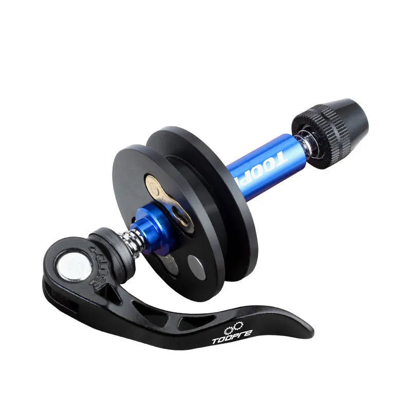 Aluminium bicycle chain holder and tensioner tool for washing, shown in hand.