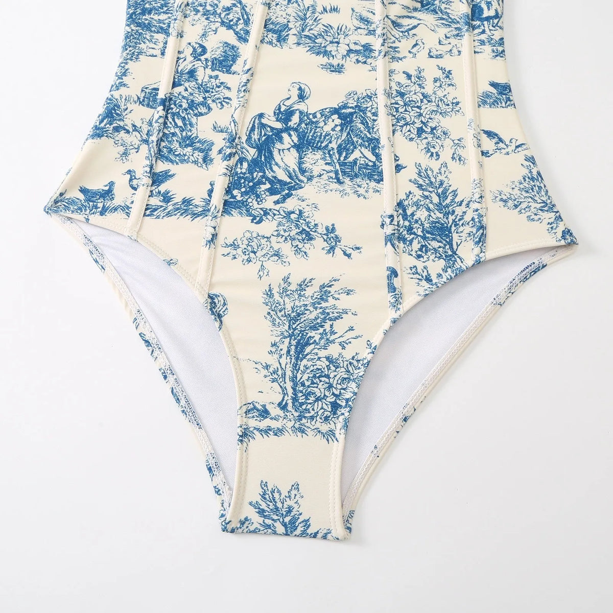 Women's blue one-piece swimsuit with matching gauze skirt set shown front and back
