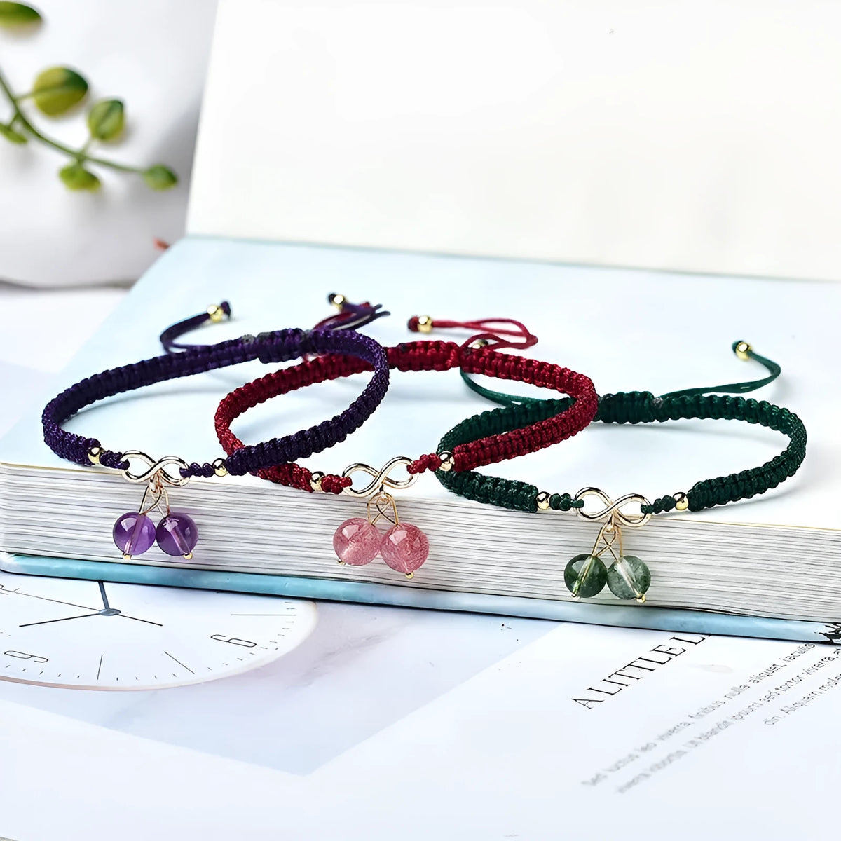 A women's bracelet with a single strand of natural strawberry quartz stones cut in a fruit shape.