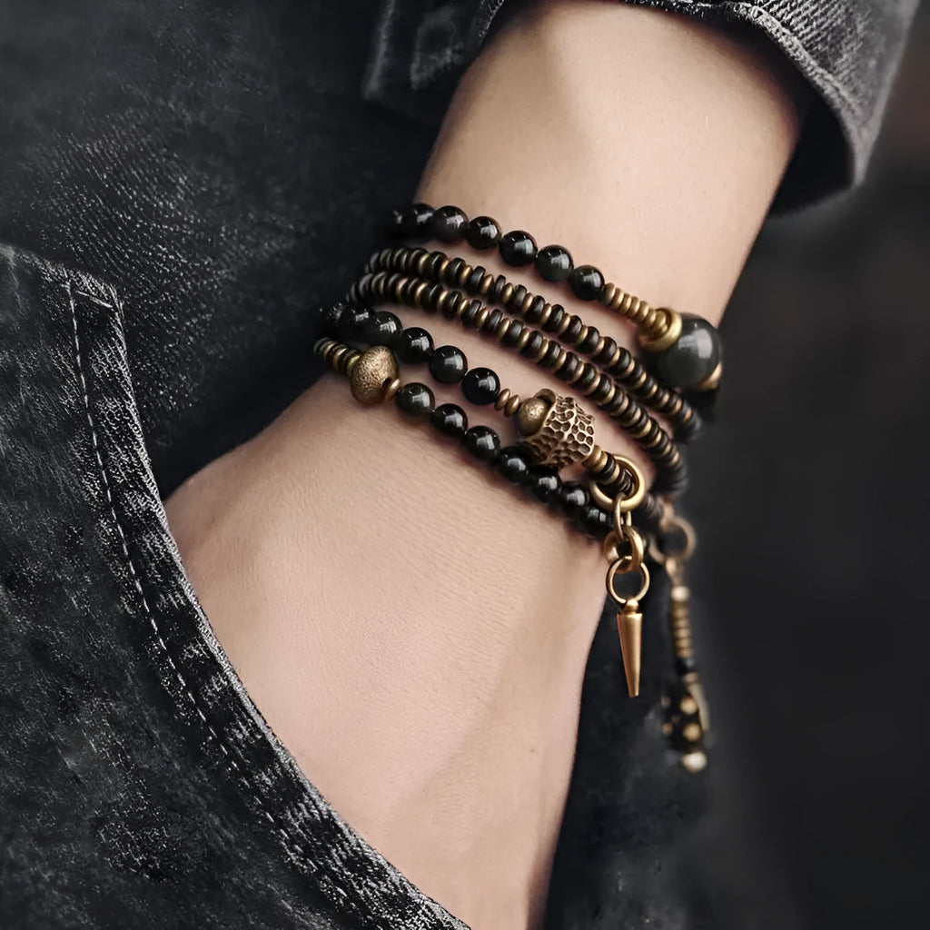Geometric black beaded bracelet with multi-layered construction and colourful detailing