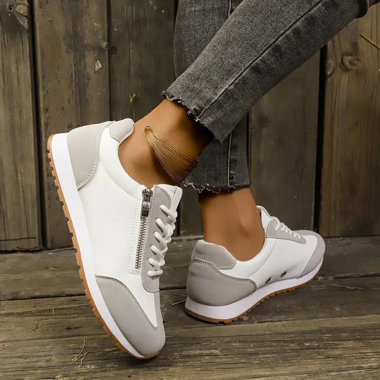 Women's flat-heeled shoes in artificial PU with rubber sole, available in grey, white, and champagne colours