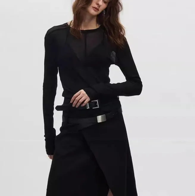 Black slim-fit mesh see-through long sleeve pullover on a model, showing texture.