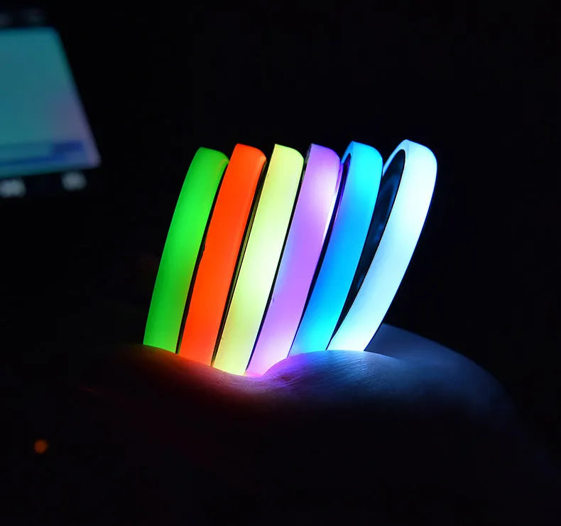 Colourful LED light-up coaster for car cup holder showing seven light modes on a non-slip acrylic surface.