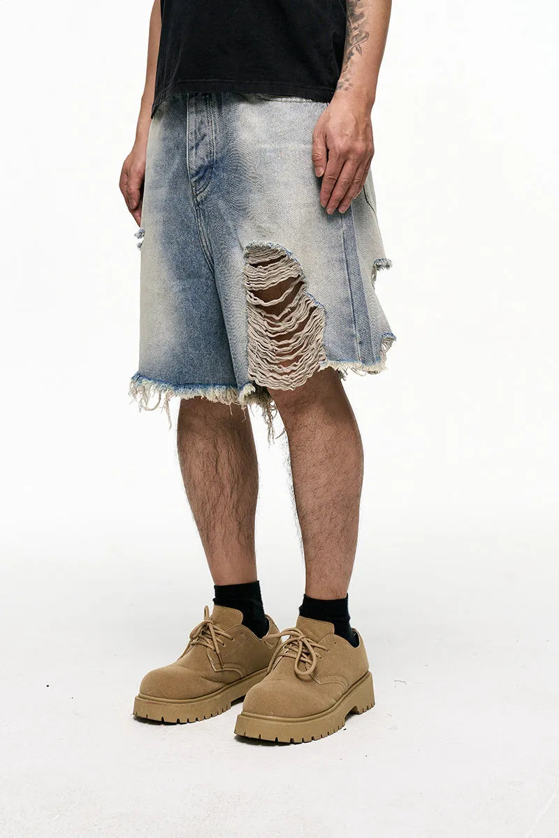 Light blue retro washed men's baggy denim shorts on a mid-waist mannequin.