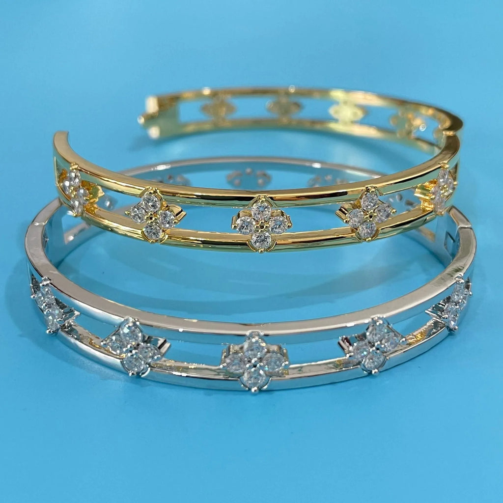 Gold or silver buckle hollow women's bracelet with four-leaf clover charm and zircon detail