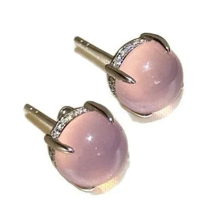 Round chalcedony stud earrings with four claw copper settings in green, white, or pink.