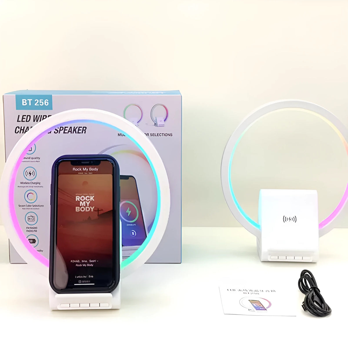 White smart Bluetooth speaker and wireless charging pad with ambient light, showing slim 10mm profile