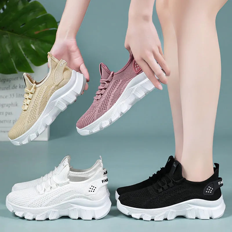 Women's white Flyknit sneakers with thick PVC sole and lace-up front