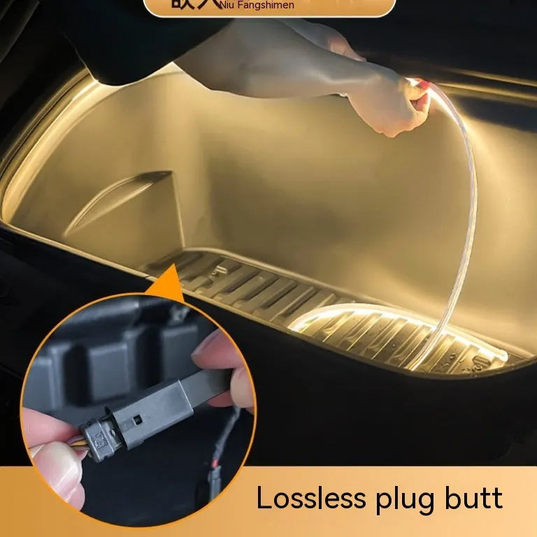 Tesla Model 3 front console illuminated by a soft silicone LED ambient light bar.