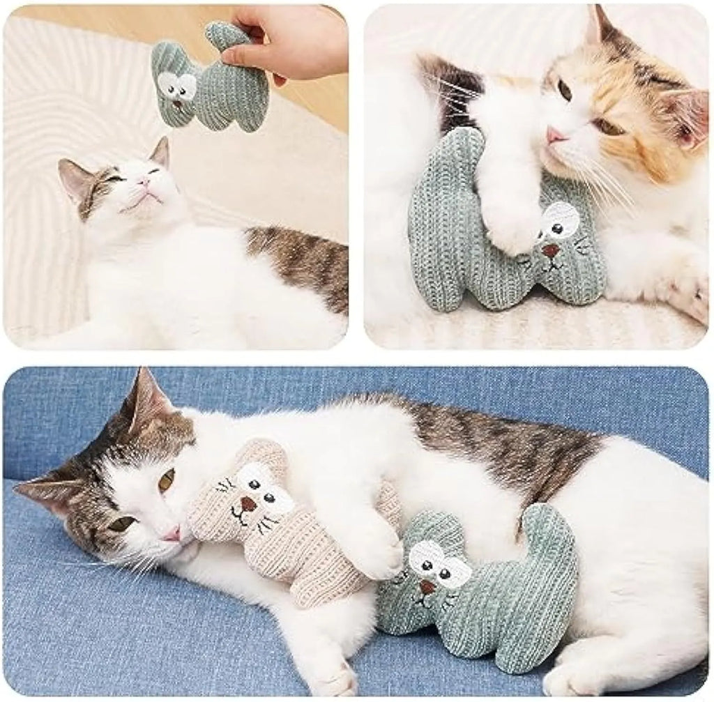Cyan and light coffee coloured knitted plush cat toy with bell and catnip, shown next to a ruler showing 12cm length.