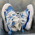 Women's grey chunky retro platform sneakers with thick rubber sole and lace-up front
