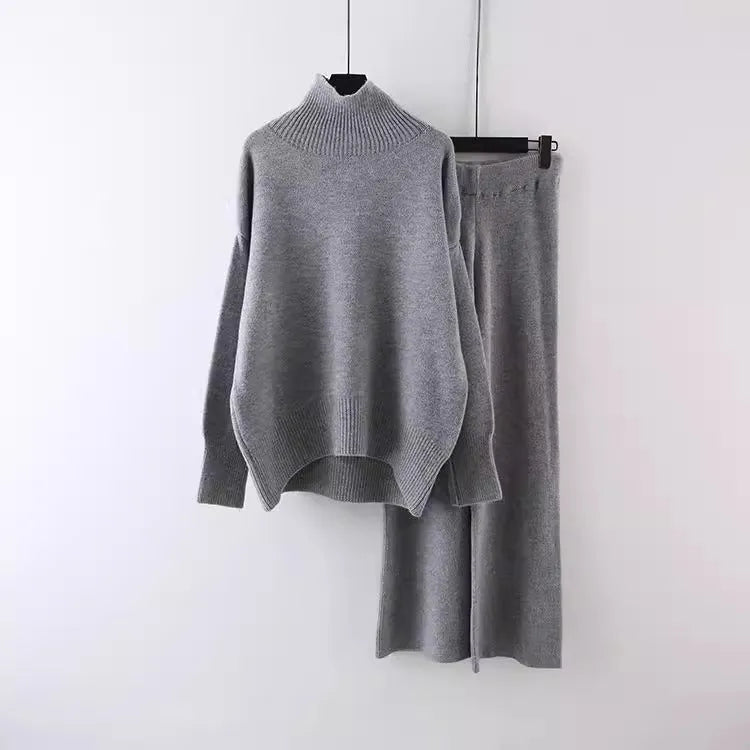 Women's milky white acrylic fibre sweater and wide-leg trousers two-piece set on a hanger.
