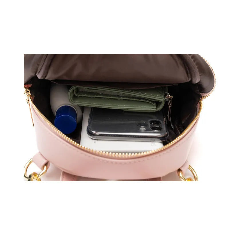 Soft PU mini backpack with three-dimensional pockets in six colour options including black, blue, pink, red, white, and yellow