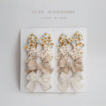 Children's cloth bow hairclips set with dovetail design in multiple colour patterns