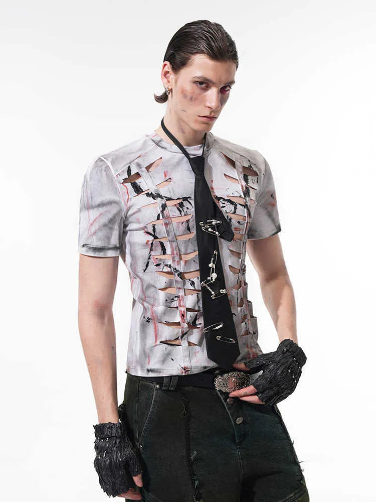 Man modelling a white men's short sleeve cotton t-shirt with a hollow-out cut design on the front.