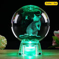 White crystal ball zodiac luminous ornament on electronic base showing Chinese animal sign