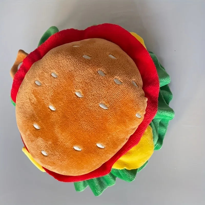 Brown burger hat costume with lettuce and cheese print on a cat, showing adjustable nylon collar.