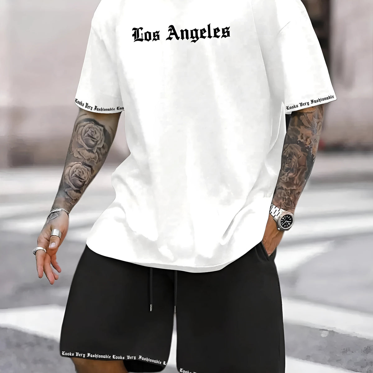 Mens blue sports style short sleeve top and shorts two-piece set on a plain background.