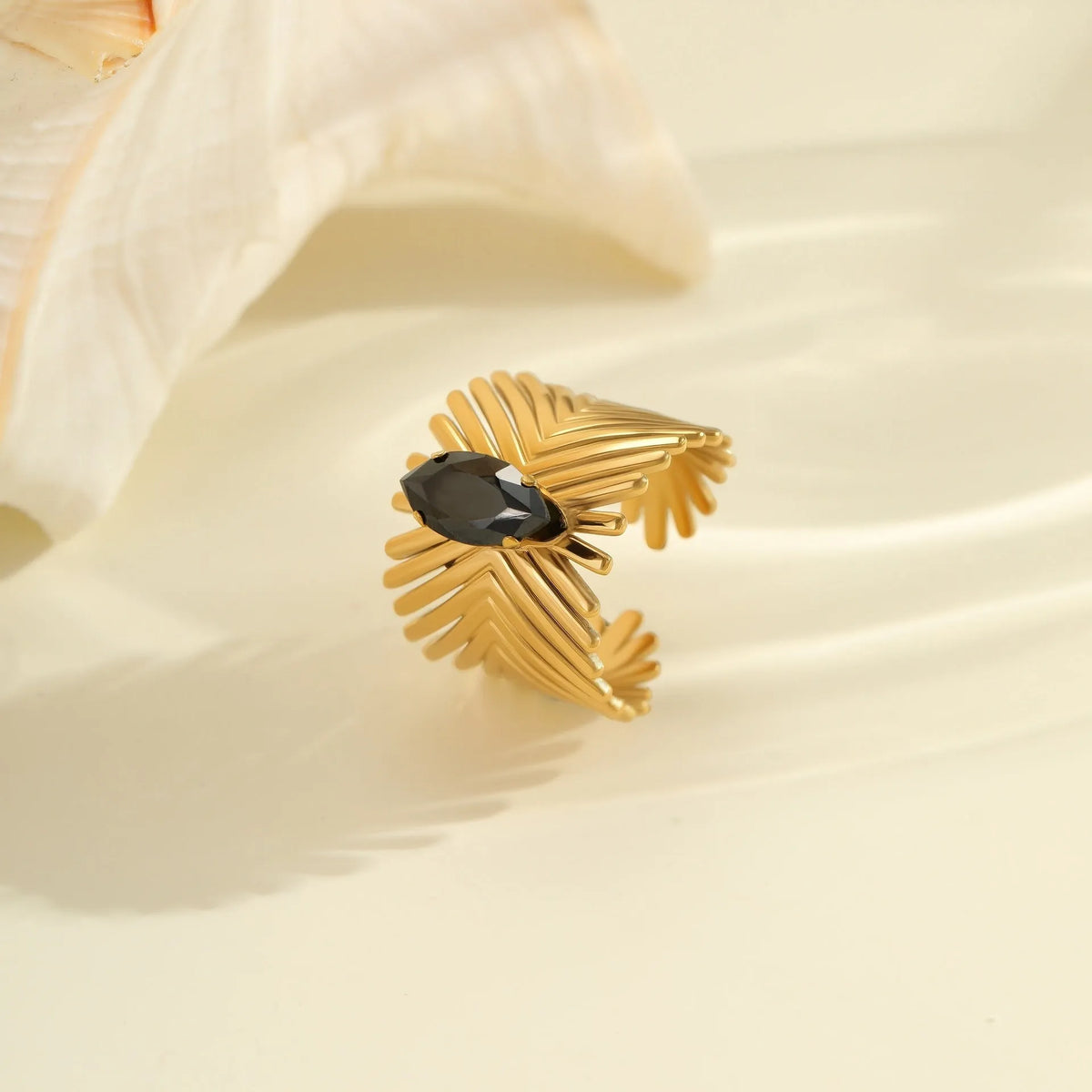 Geometric stainless steel ring with open mouth design and inlaid zircon details