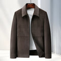 Men's slim fit casual coat with lapel collar in dark blue colour on a hanger.