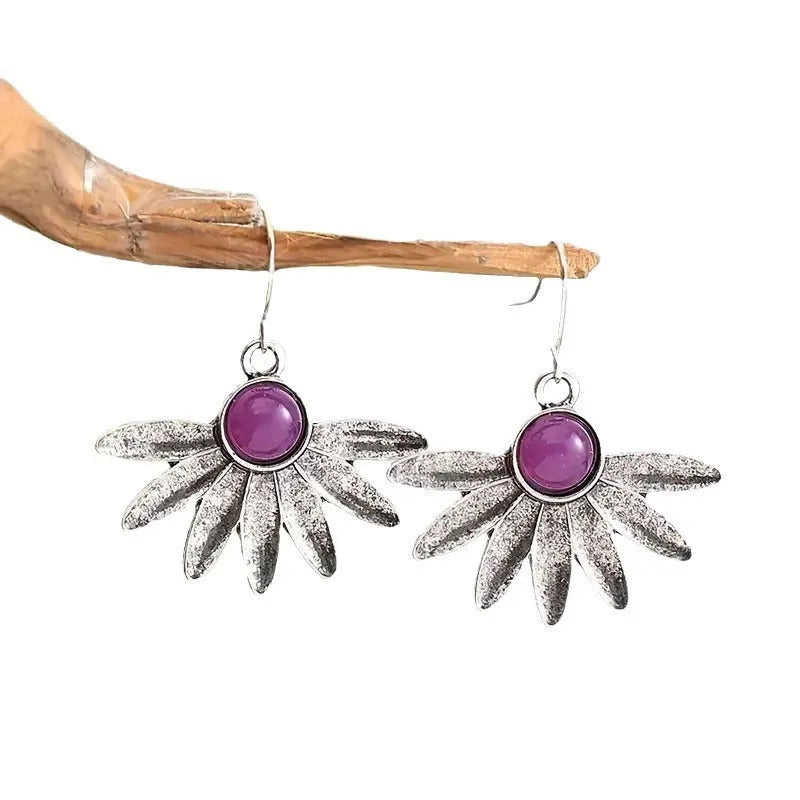 Purple bohemian-style earrings with animal and Zodiac modelling in resin and alloy.