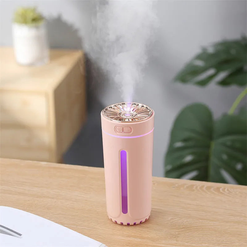 Black wireless USB humidifier with colourful lights on a car dashboard cup holder