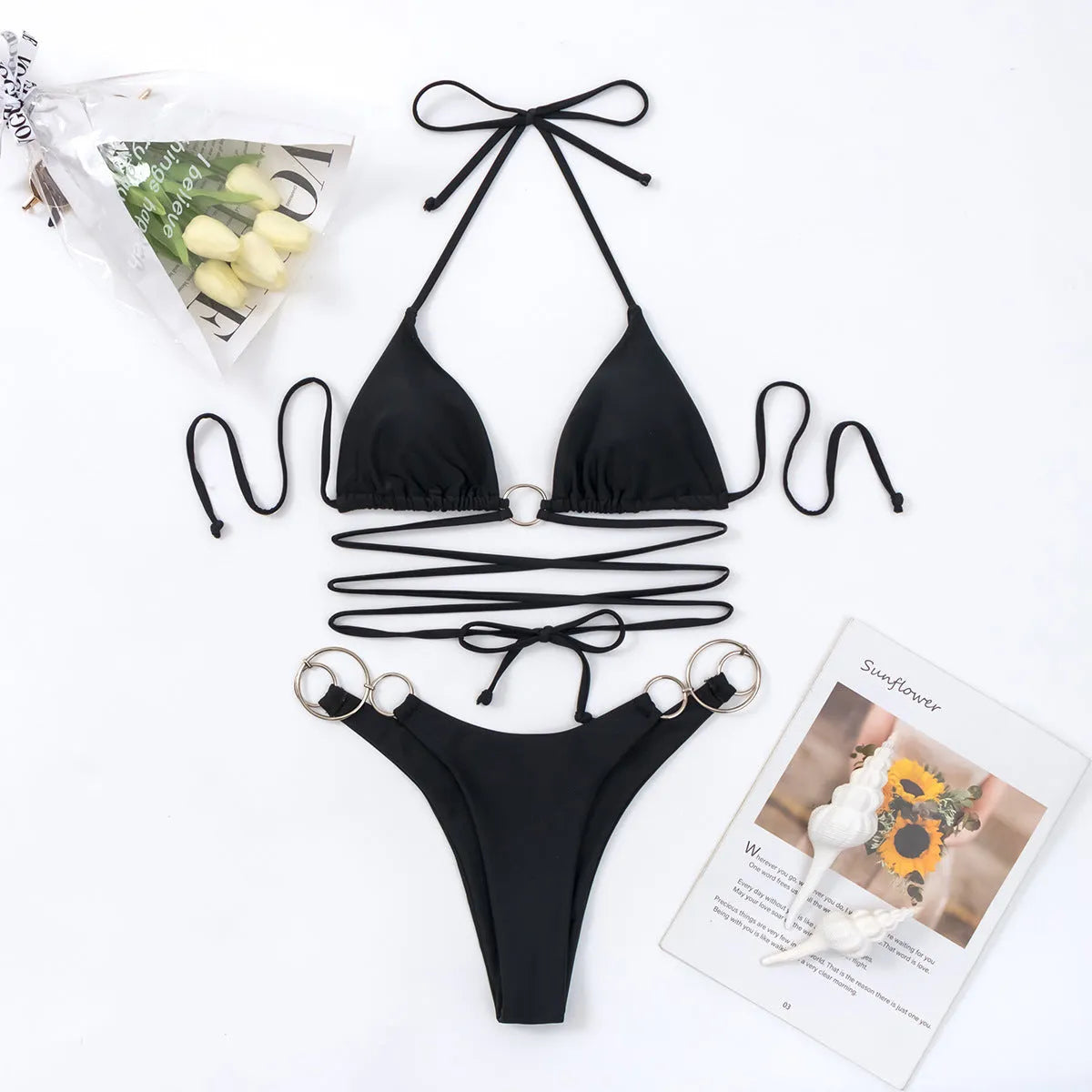Black women's bikini set with metal ring straps and split-style panties for swimming