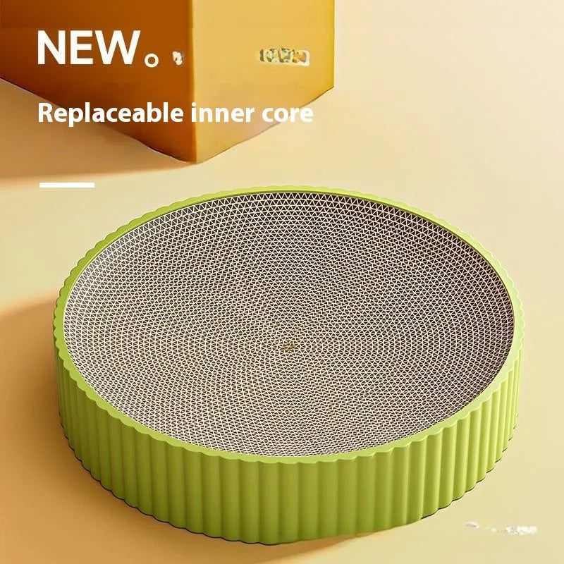 Round green cat scratching board made from corrugated cardboard with two replacement inserts