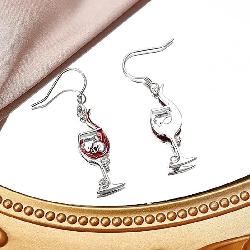 A pair of zinc alloy Halloween earrings with a skull and wine glass design.