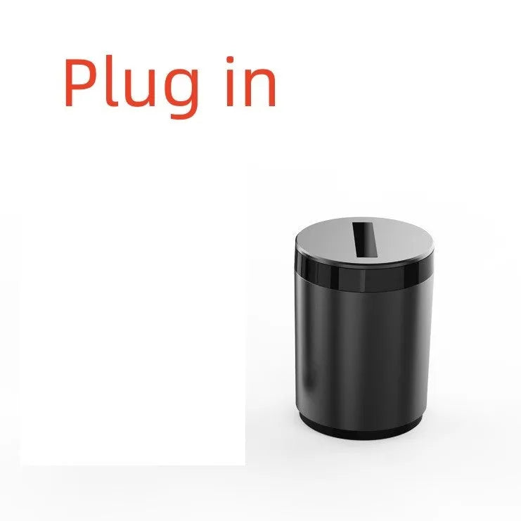 Silver intelligent induction ashtray with automatic lid on a table, showing compact size.