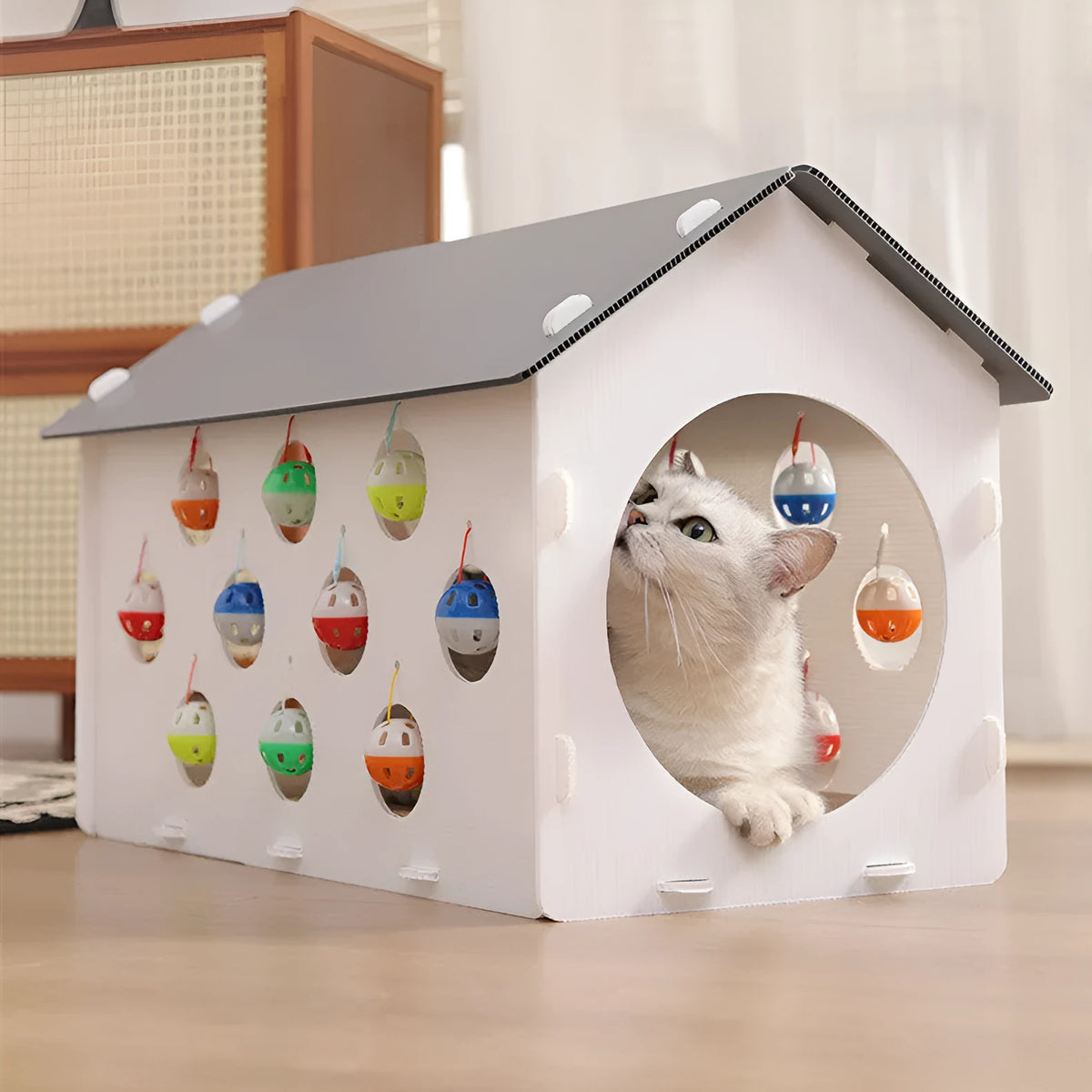 Plastic cat scratch board integrated with nest area and tunnel containing bell balls