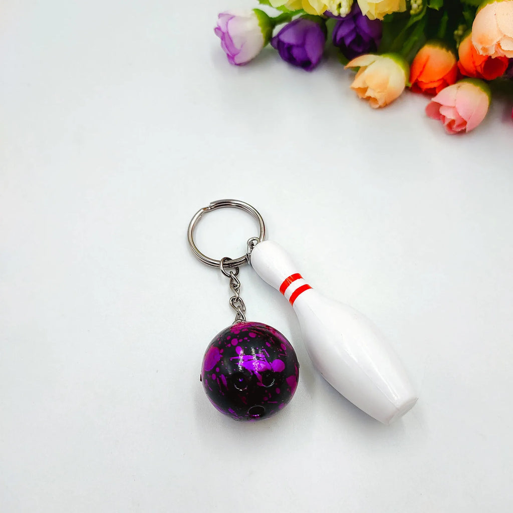 Mini simulation bowling keychain pendant in PVC metal showing four colour options