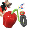 Green apple-shaped dog chew toy with treat dispensing opening and plastic construction