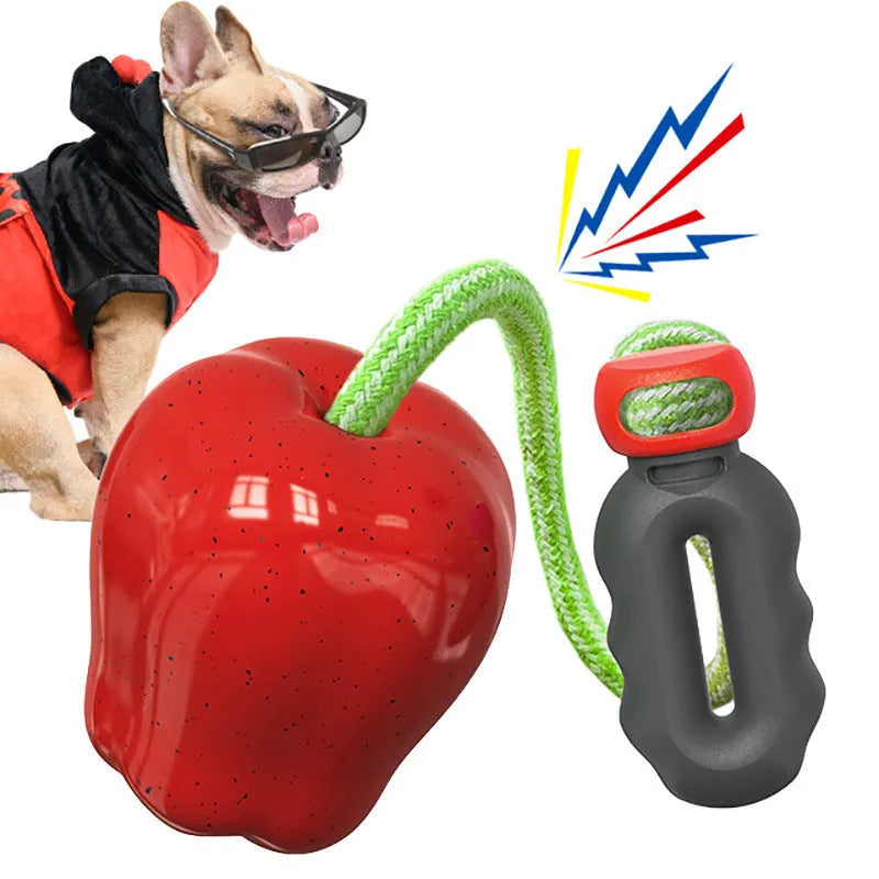 Green apple-shaped dog chew toy with treat dispensing opening and plastic construction