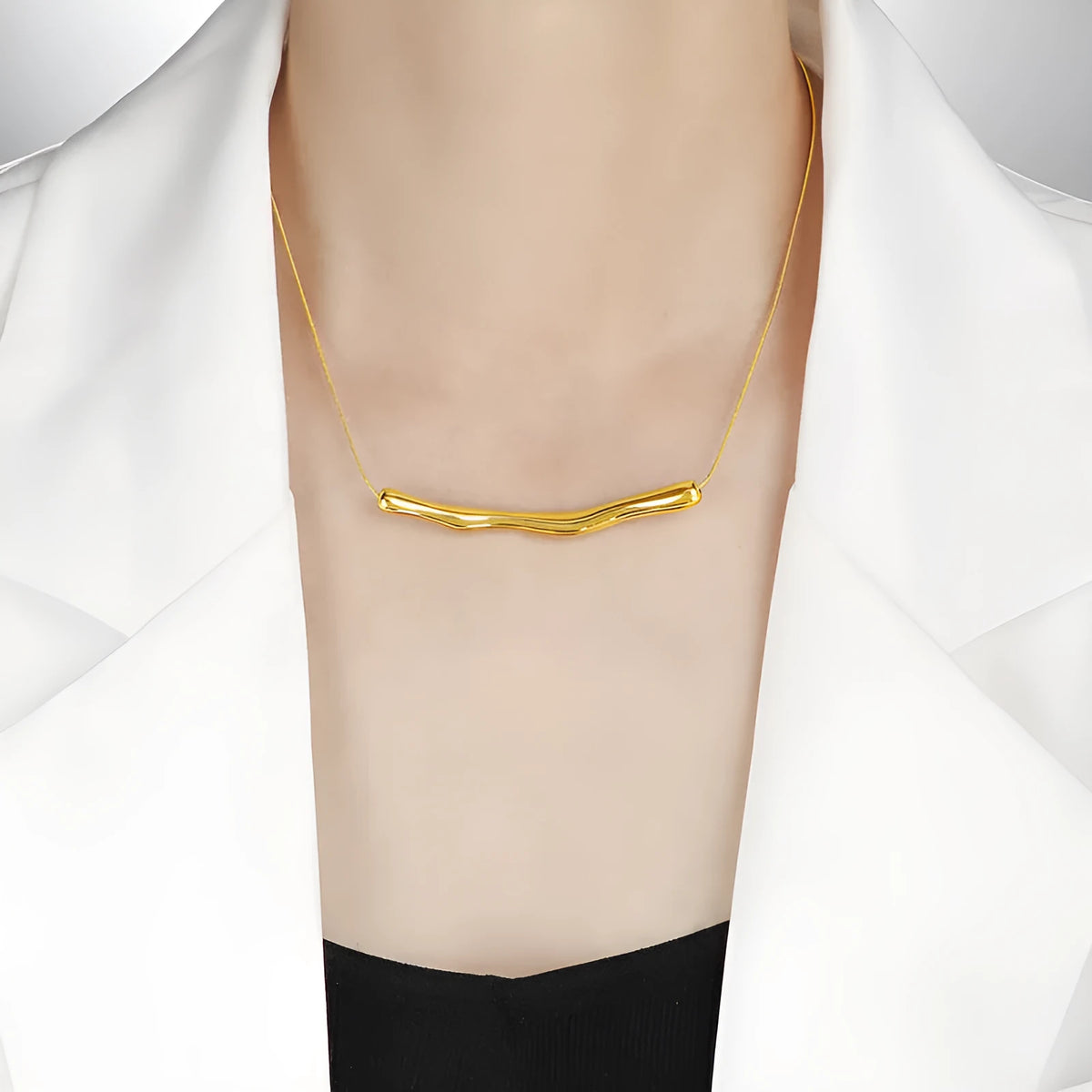 Women's titanium steel pleated necklace in gold tone with irregular textured finish.