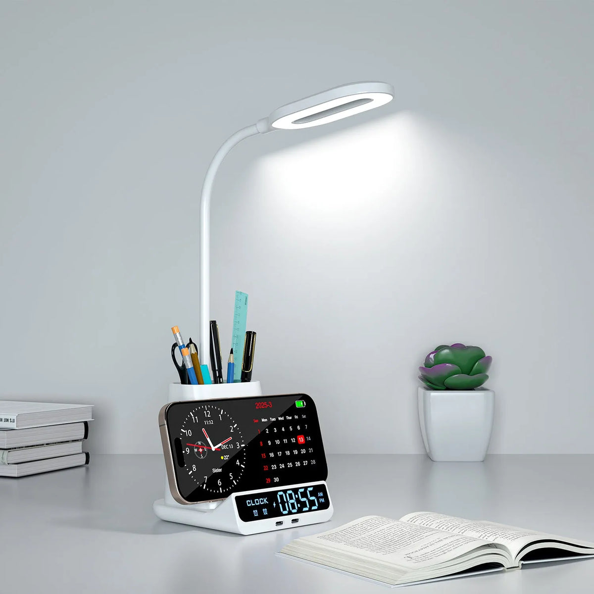 Modern black desk lamp with wireless charging base, integrated pen holder, and small storage compartments.
