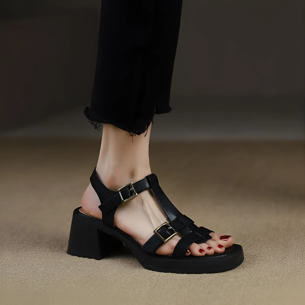 Black retro women's sandals with T-buckle, chunky platform heel and open square toe.