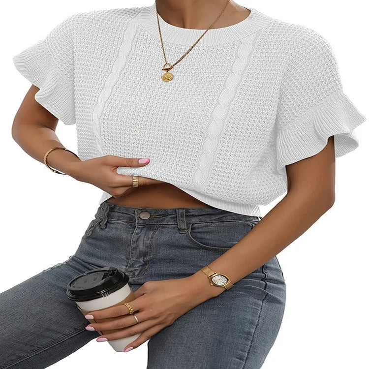 Knitted pullover sweater with ruffled short sleeves and twisted string detail in a loose fit.