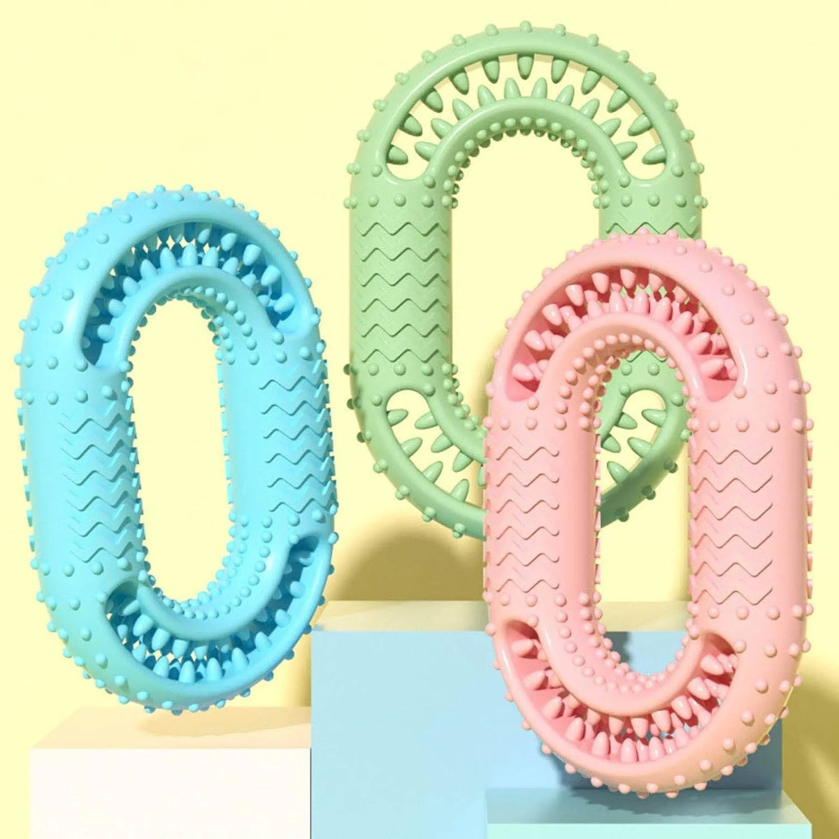 Blue green pink O-ring shaped dog chew toy for aggressive chewers measuring 12.5 by 8.6 centimetres