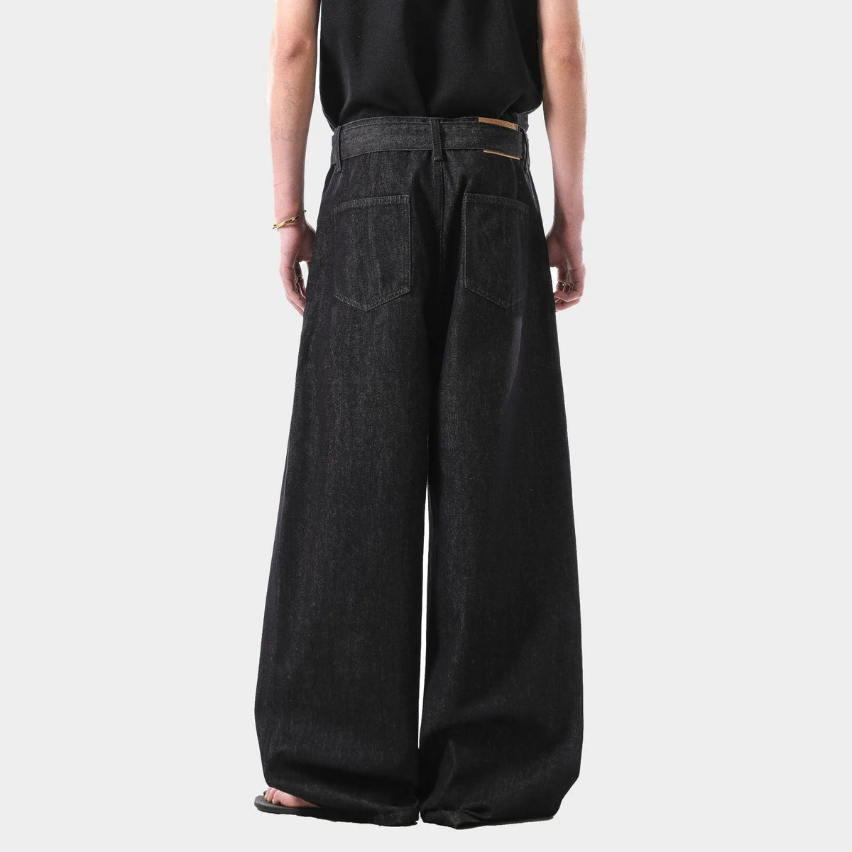 Black American retro high waist straight leg jeans on a model, showing the zip fly and straight cut.