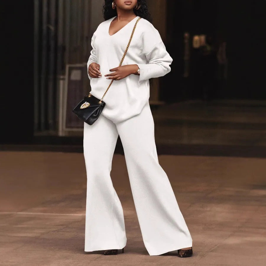 Brown women's casual two-piece suede suit with split sleeve top and trousers on a model.