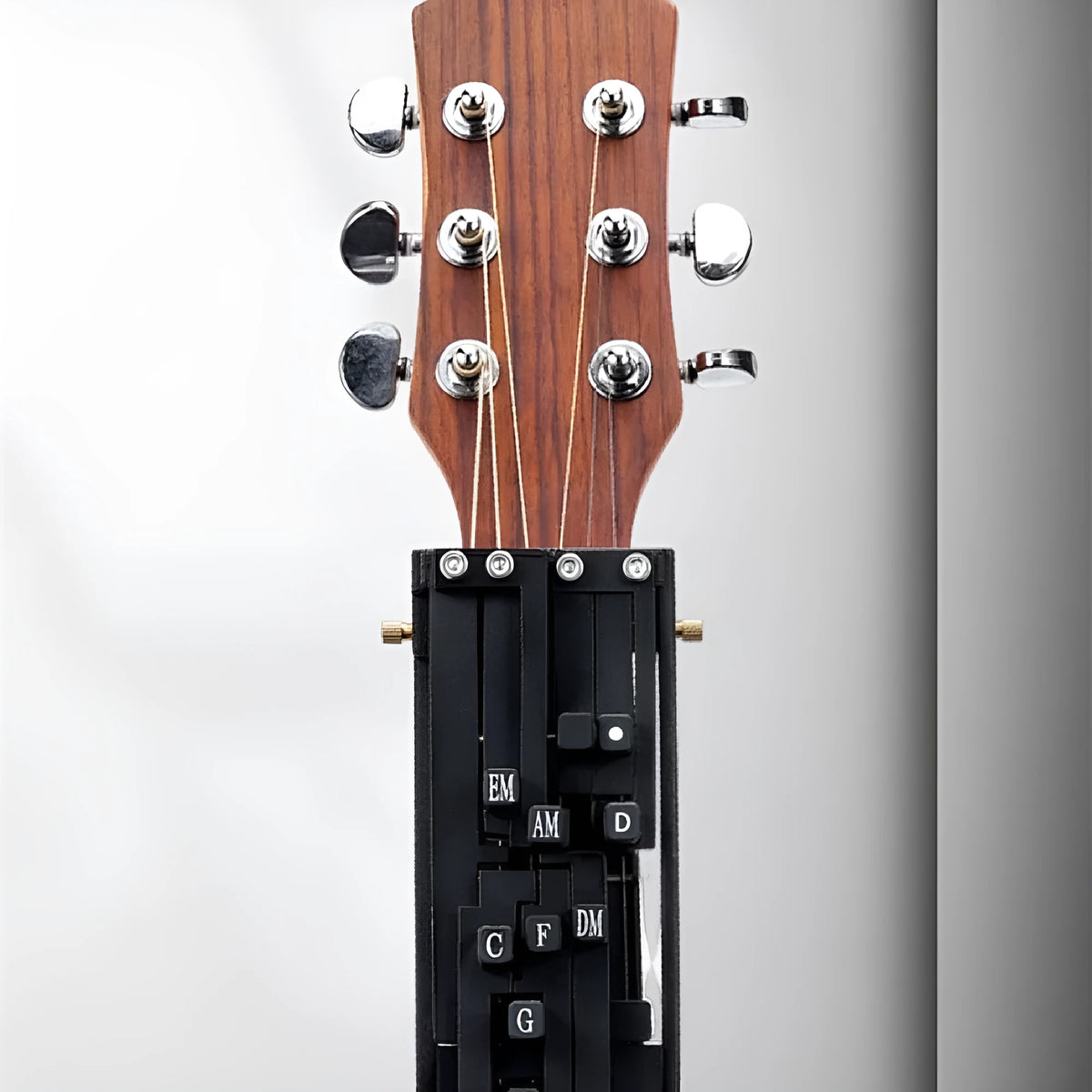 Black automatic guitar chord device for novice folk guitar playing and singing practice
