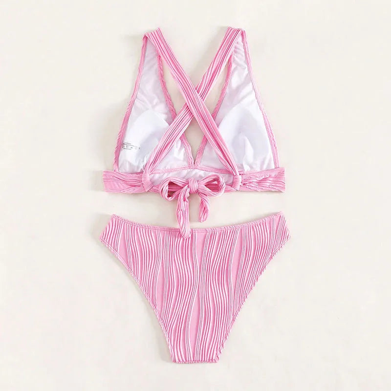 Women's halter strap bikini in black or pink with matching top and shorts