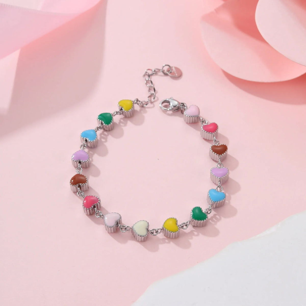 Women's heart-shaped stainless steel bracelet with 18K electroplated finish in gold or steel tone.